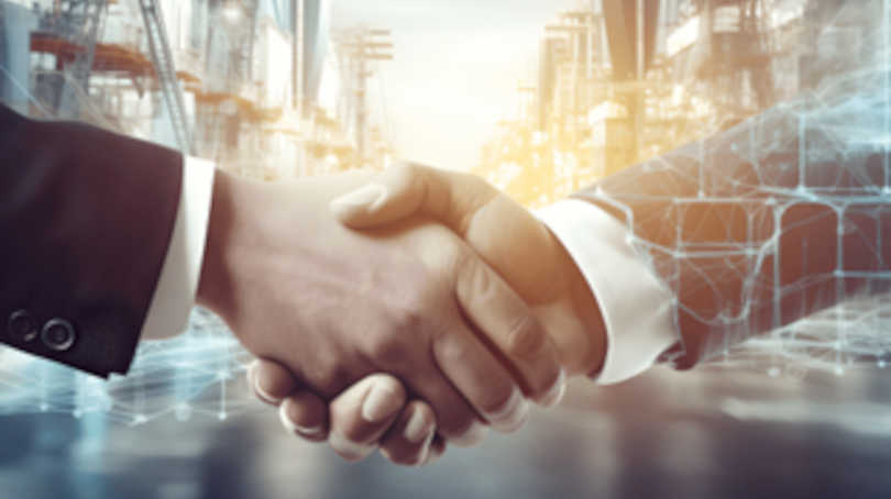 People Shaking Hands In Front Of Factory With Tech Graphics