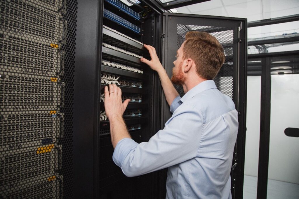 Man Looking At Rack System